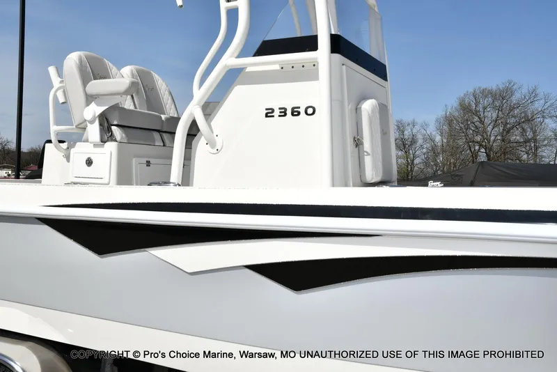 Slide: The Image of 2023 Ranger 2360 Bay boat with sleek design and comfortable seating. - 2