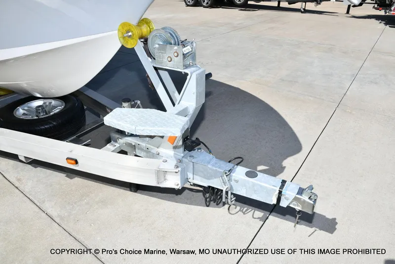 Slide: The Image of 2023 Ranger 2360 Bay boat trailer hitch and winch on concrete surface. - 21
