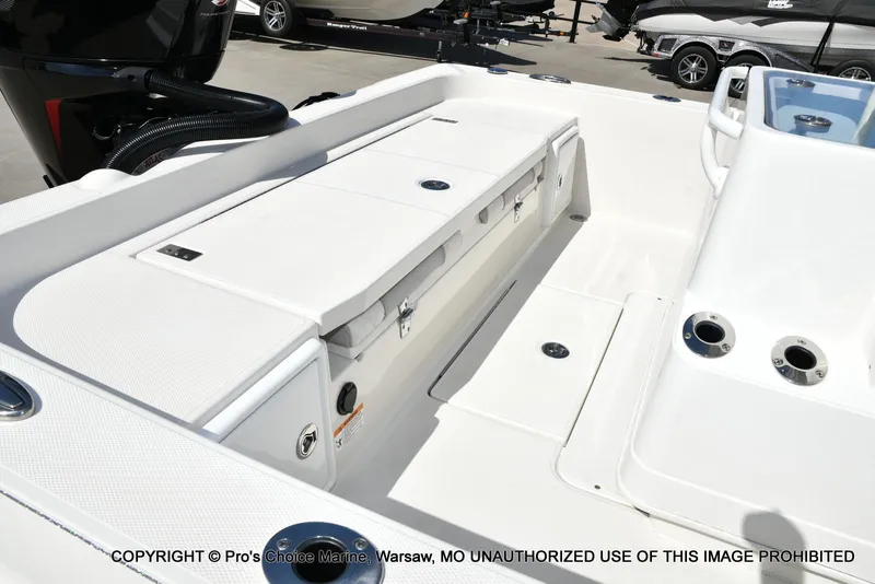 Slide: The Image of 2023 Ranger 2360 Bay boat interior with storage compartments and seating. - 24