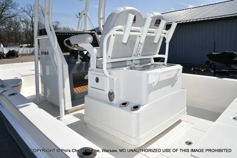 Slide: The Image of 2023 Ranger 2360 Bay boat interior with seating and steering console. - 27