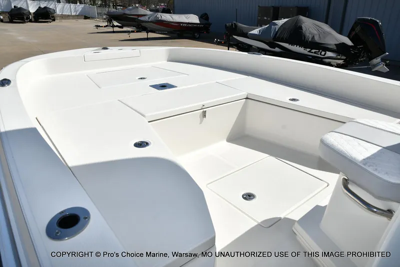 Slide: The Image of 2023 Ranger 2360 Bay boat interior with spacious deck and storage compartments. - 29