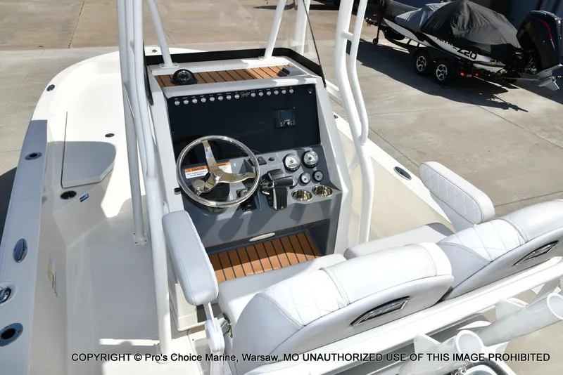Slide: The Image of 2023 Ranger 2360 Bay boat interior with steering console and seating. - 30
