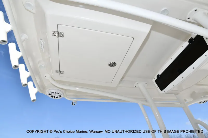 Slide: The Image of 2023 Ranger 2360 Bay boat ceiling with storage compartment and rod holders. - 37