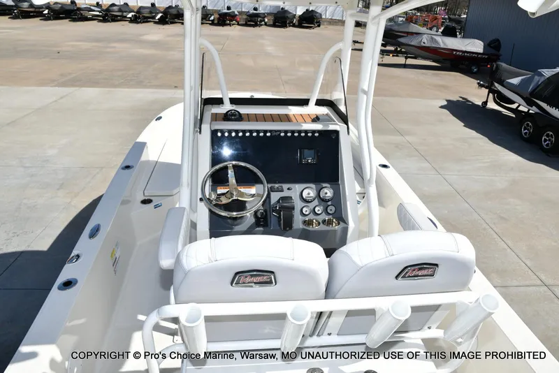 Slide: The Image of 2023 Ranger 2360 Bay boat interior with steering wheel and control panel. - 4