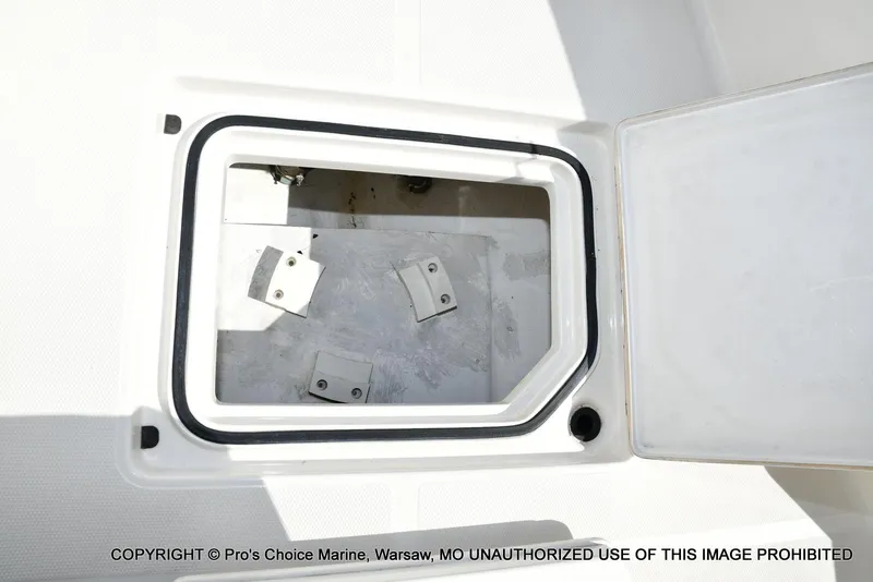 Slide: The Image of Open storage compartment on 2023 Ranger 2360 Bay boat deck. - 45