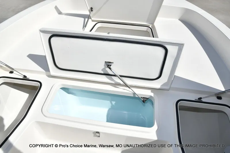 Slide: The Image of 2023 Ranger 2360 Bay boat with open storage compartments and livewell. - 46