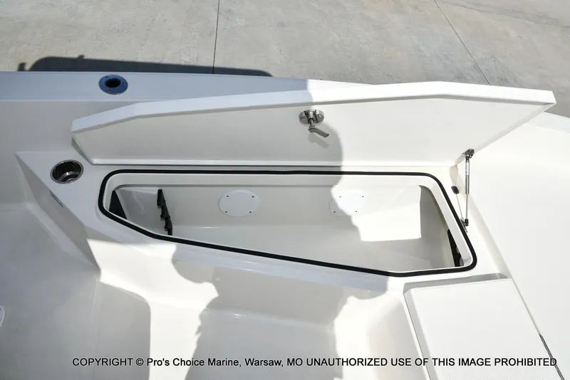 Slide: The Image of Open storage compartment on 2023 Ranger 2360 Bay boat, featuring a sleek design. - 48