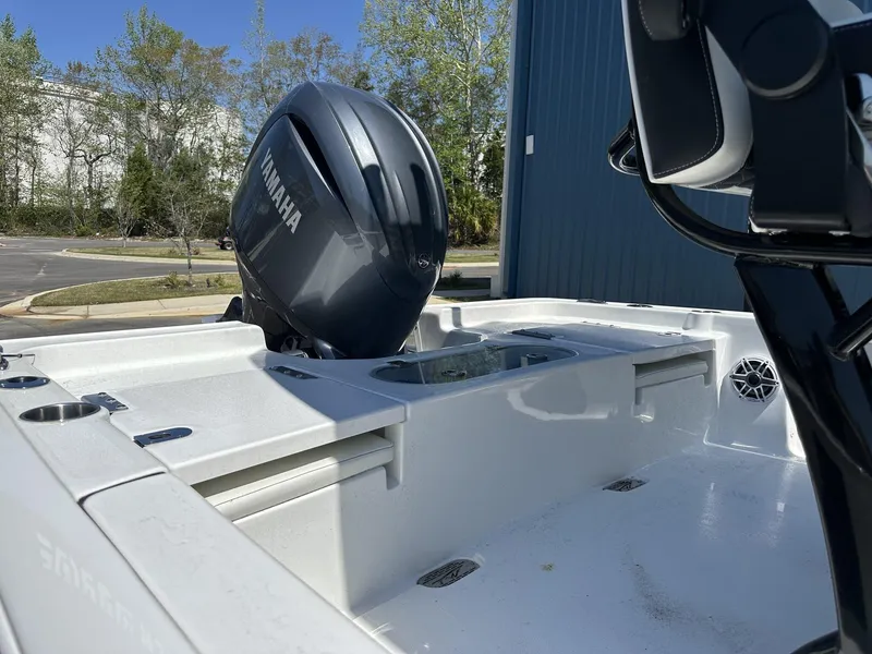 Slide: The Image of 2025 Tidewater 2110 Bay Max boat with Yamaha engine, parked outdoors. - 13