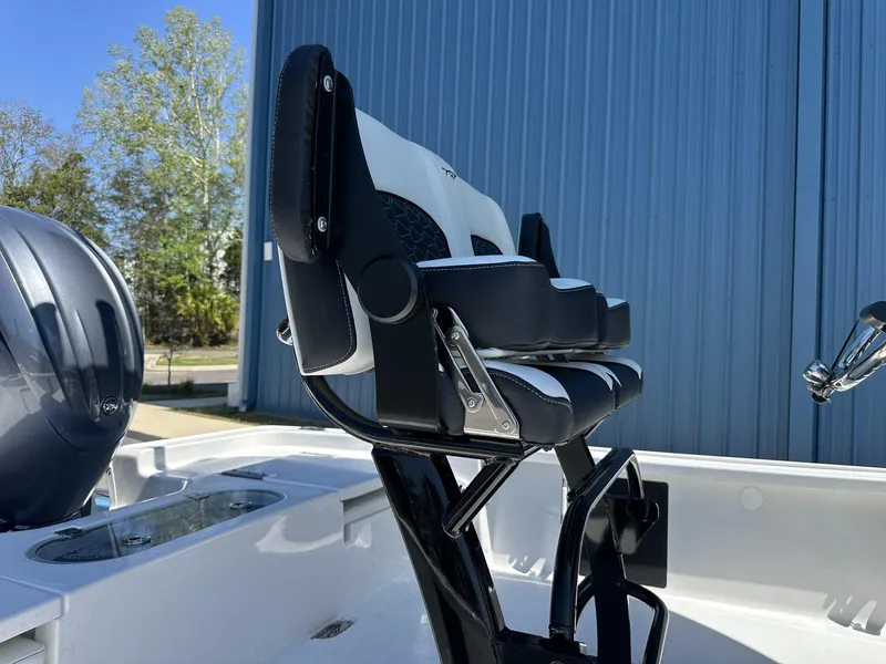 Slide: The Image of 2025 Tidewater 2110 Bay Max boat seat and console, with blue exterior backdrop. - 14