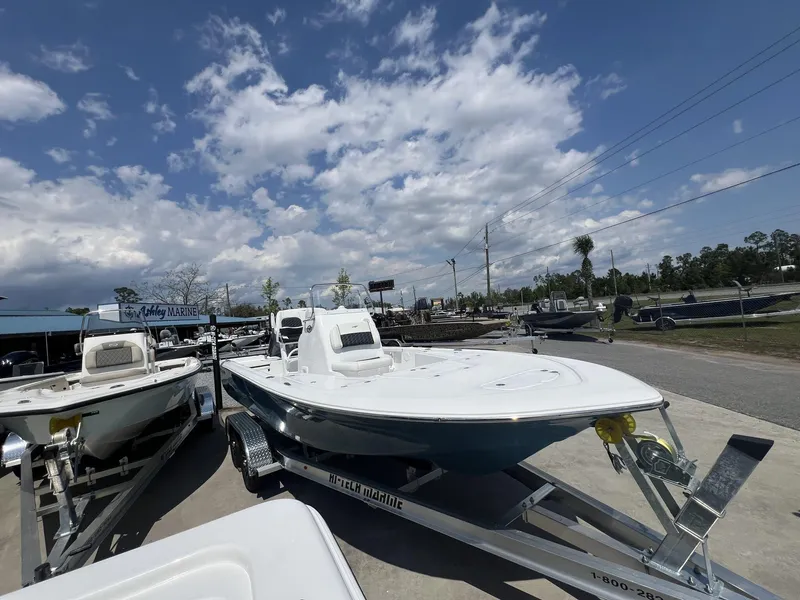 Slide: The Image of 2025 Tidewater 2110 Bay Max boat on trailer under cloudy sky at dealership. - 7