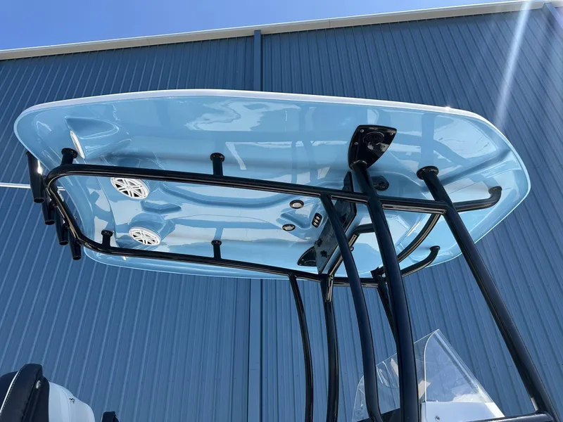 Slide: The Image of 2025 Tidewater 2110 Bay Max T-top with speakers, against a blue building backdrop. - 15