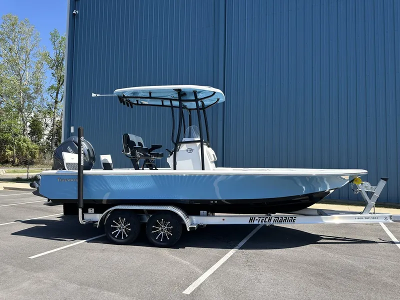 Slide: The Image of 2025 Tidewater 2110 Bay Max boat on trailer, parked outdoors. - 5