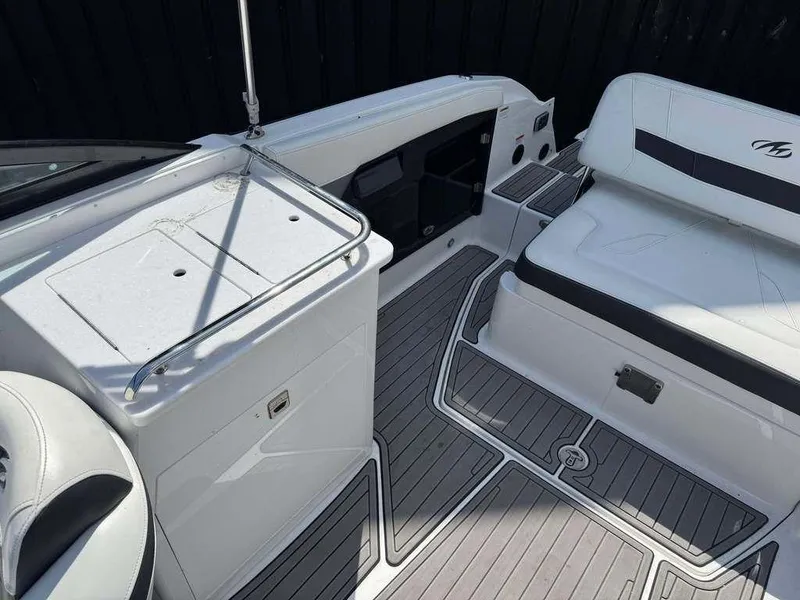 Slide: The Image of 2015 Monterey 258SS boat interior with seating and storage, featuring sleek design and modern amenities. - 4