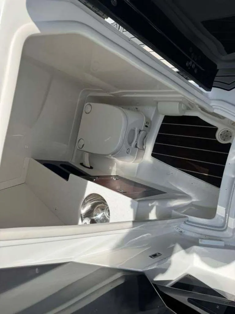 Slide: The Image of 2015 Monterey 258SS boat interior with compact bathroom and sink. - 6