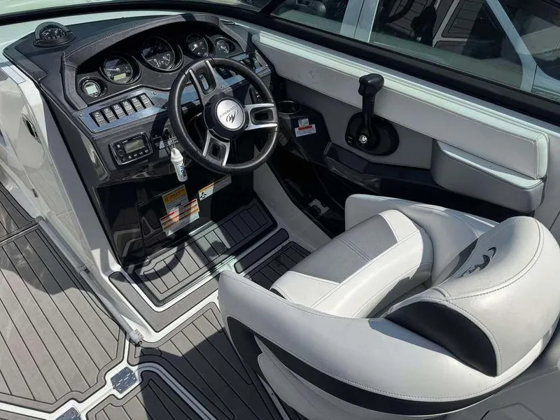 Slide: The Image of 2015 Monterey 258SS boat cockpit with steering wheel and control panel. - 7
