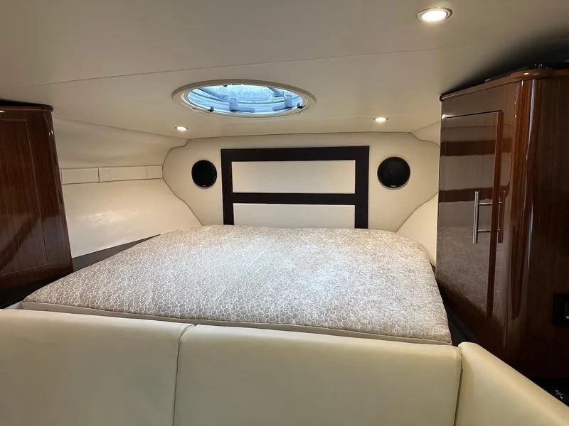 Slide: The Image of Interior cabin of 2015 Regal 32 Express yacht with bed and porthole. - 18