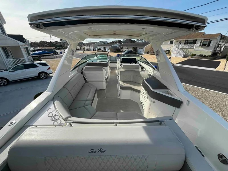 Slide: The Image of 2021 Sea Ray SLX 310 OB boat with spacious seating and modern design. - 15