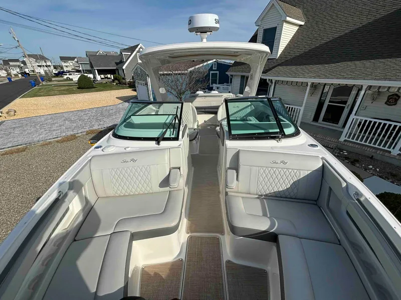 Slide: The Image of 2021 Sea Ray SLX 310 OB boat with spacious seating and modern design. - 17