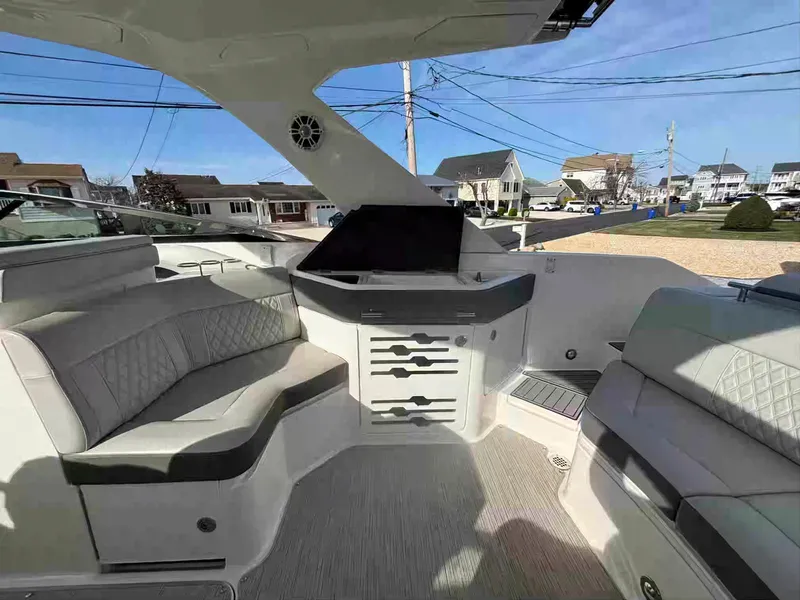 Slide: The Image of 2021 Sea Ray SLX 310 OB boat interior with luxurious seating and modern design. - 18