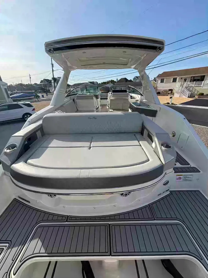 Slide: The Image of 2021 Sea Ray SLX 310 OB boat with spacious seating and sleek design. - 19