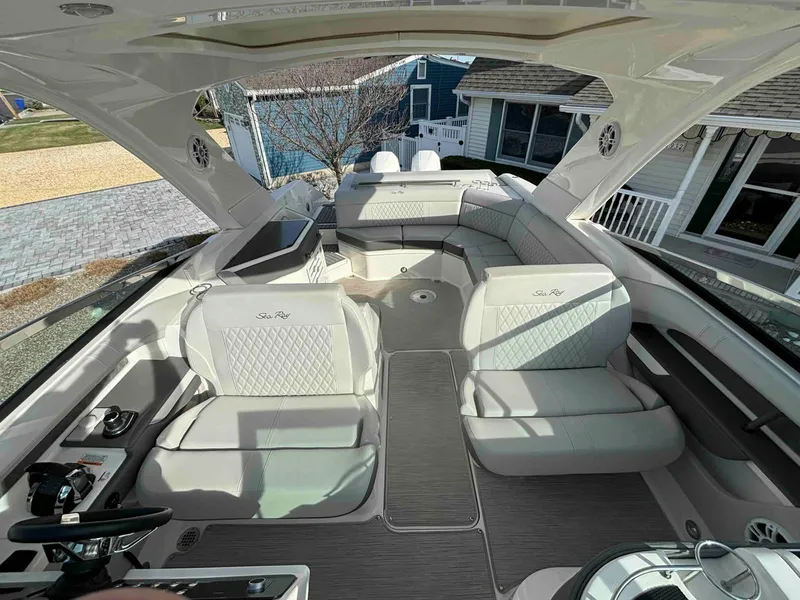 Slide: The Image of 2021 Sea Ray SLX 310 OB boat interior with luxurious seating and modern design. - 22