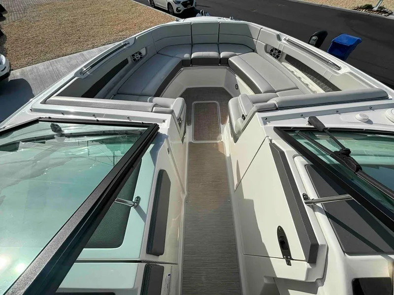 Slide: The Image of 2021 Sea Ray SLX 310 OB boat interior with spacious seating and modern design. - 25