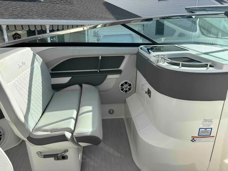 Slide: The Image of 2021 Sea Ray SLX 310 OB boat interior with sleek seating and modern design. - 28