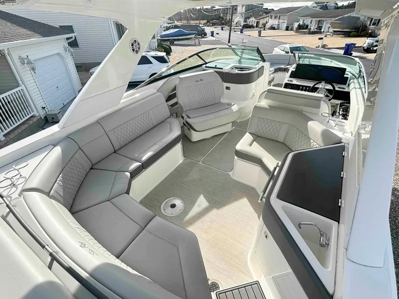 Slide: The Image of Luxurious 2021 Sea Ray SLX 310 OB boat interior with spacious seating and modern design. - 29