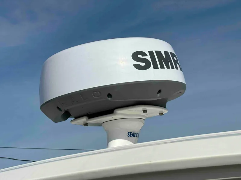 Slide: The Image of Simrad radar on 2021 Sea Ray SLX 310 OB boat under clear sky. - 34