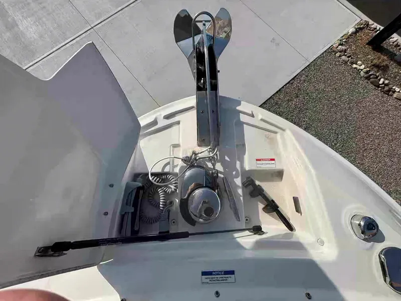 Slide: The Image of 2021 Sea Ray SLX 310 OB boat anchor system on deck. - 38