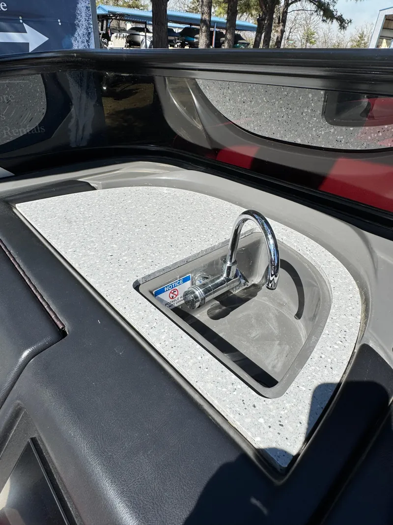 Slide: The Image of 2023 South Bay 25 Sport RS9 DC boat sink with modern faucet and countertop. - 16