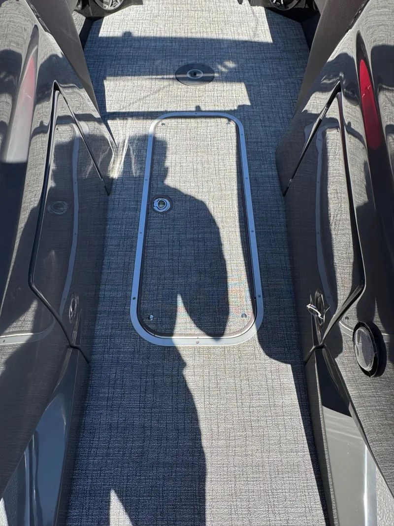 Slide: The Image of 2023 South Bay 25 Sport RS9 DC boat interior with textured flooring. - 18
