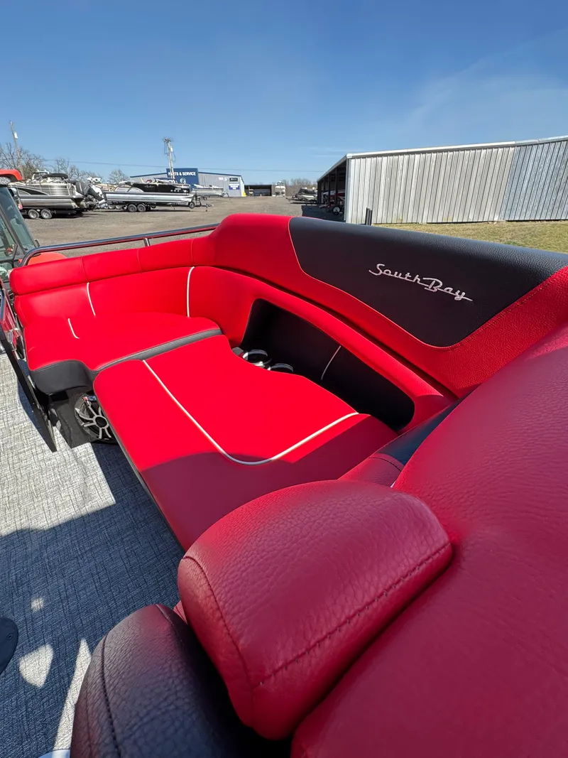 Slide: The Image of Red and black interior of 2023 South Bay 25 Sport RS9 DC boat. - 8
