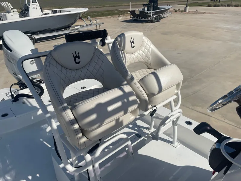 Slide: The Image of Luxury seating on 2022 Catalyst 2550 CAT boat, featuring quilted white upholstery. - 17