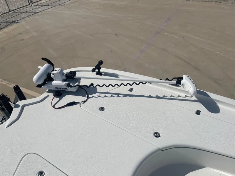 Slide: The Image of 2022 Catalyst 2550 CAT boat with Minn Kota trolling motor on deck. - 24