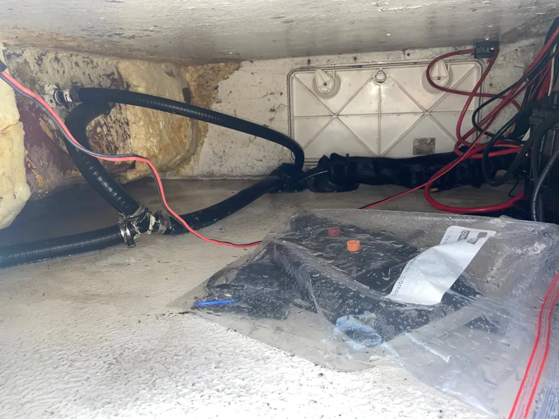 Slide: The Image of Interior view of a 2022 Catalyst 2550 CAT boat showing wiring and components. - 26