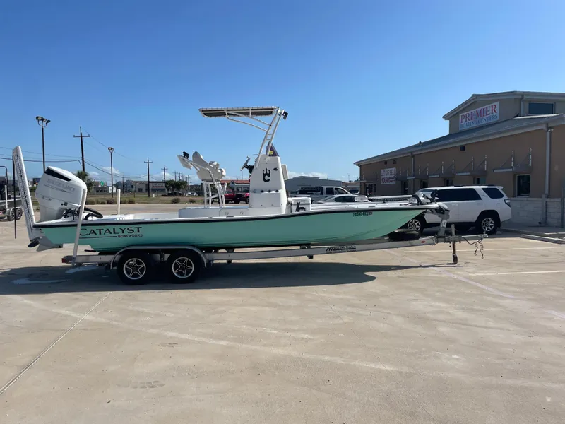 Slide: The Image of 2022 Catalyst 2550 CAT boat on trailer in parking lot, sunny day. - 5