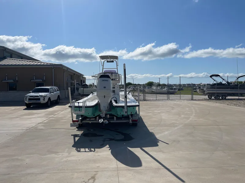 Slide: The Image of 2022 Catalyst 2550 CAT boat on trailer in sunny parking lot. - 6