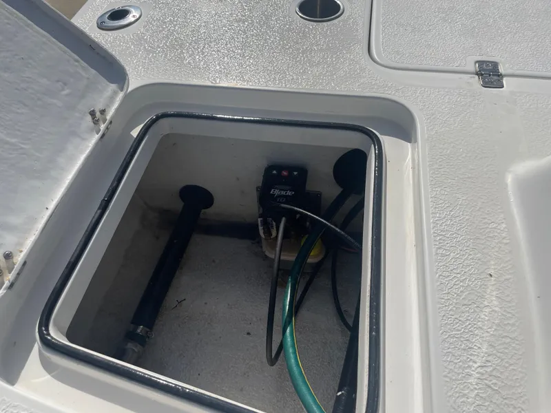 Slide: The Image of Open compartment on 2022 Catalyst 2550 CAT boat showing internal wiring and components. - 8