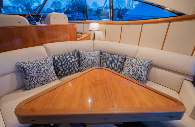 Slide: The Image of Luxurious Neptunus 54 Express yacht interior with elegant seating and decorative cushions, 2000 model. - 1