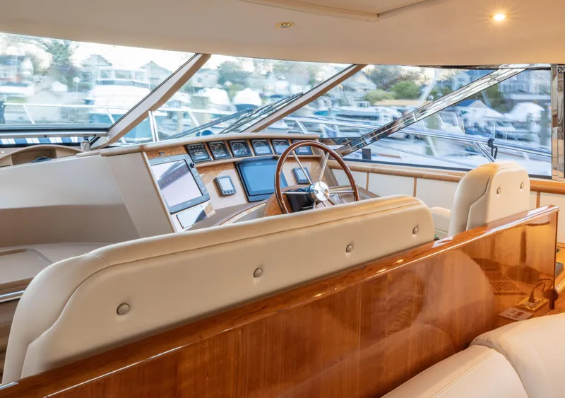 Slide: The Image of Luxurious Neptunus 54 Express yacht interior with leather seating and modern dashboard, 2000 model. - 11