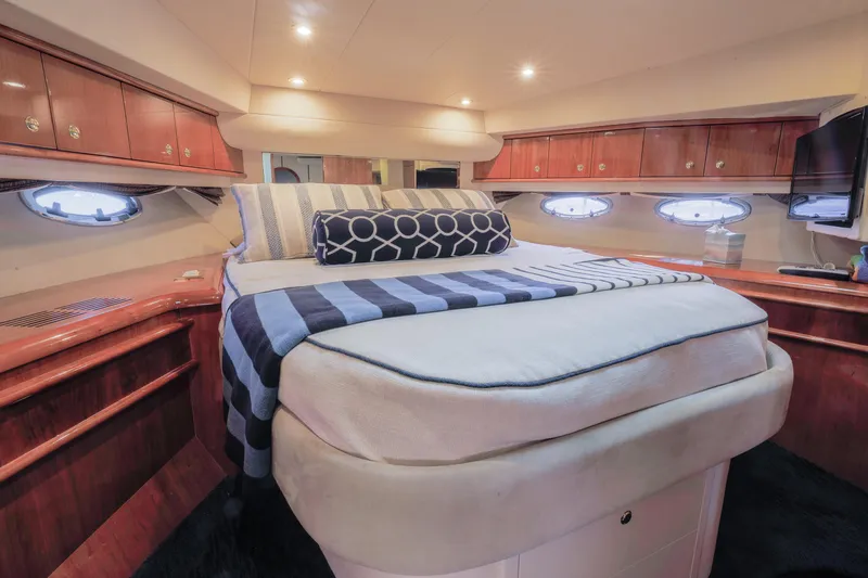 Slide: The Image of Luxurious cabin interior of 2000 Neptunus 54 Express yacht with elegant wood finishes. - 2