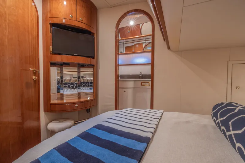 Slide: The Image of Luxurious cabin interior of 2000 Neptunus 54 Express yacht with wood finishes and modern amenities. - 29