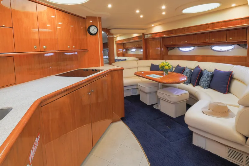 Slide: The Image of Luxurious interior of 2000 Neptunus 54 Express yacht with elegant wood finishes and plush seating. - 3