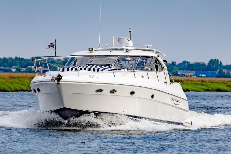 Slide: The Image of 2000 Neptunus 54 Express yacht cruising on a sunny day. - 4