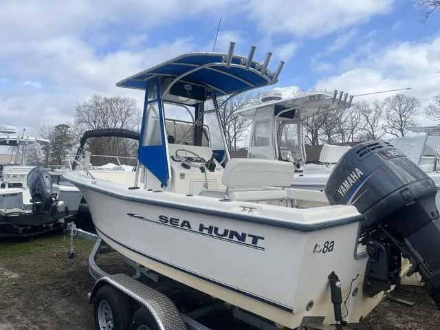 Slide: The Image of 2002 Sea Hunt 202 TRITON boat with Yamaha motor on trailer, parked outdoors. - 3