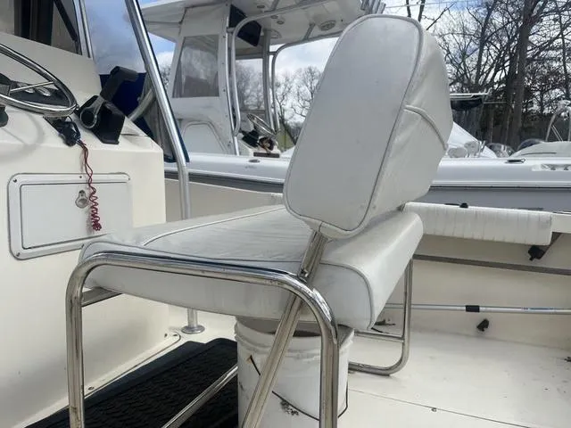 Slide: The Image of White seating on 2002 Sea Hunt 202 TRITON boat, featuring stainless steel frame. - 6