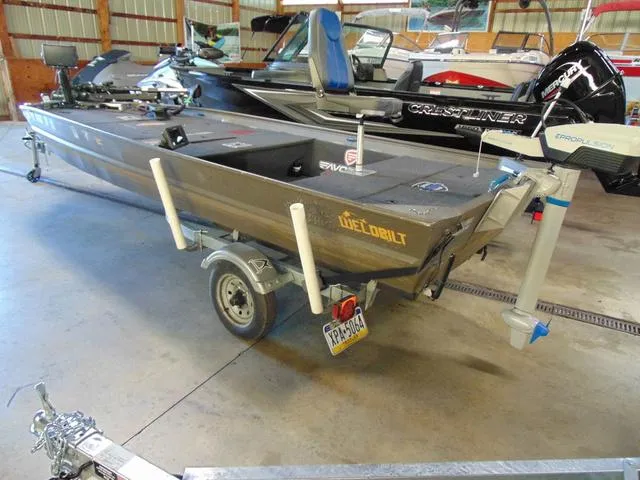 Slide: The Image of 2016 WeldBilt 1647 boat on trailer in a garage setting. - 2