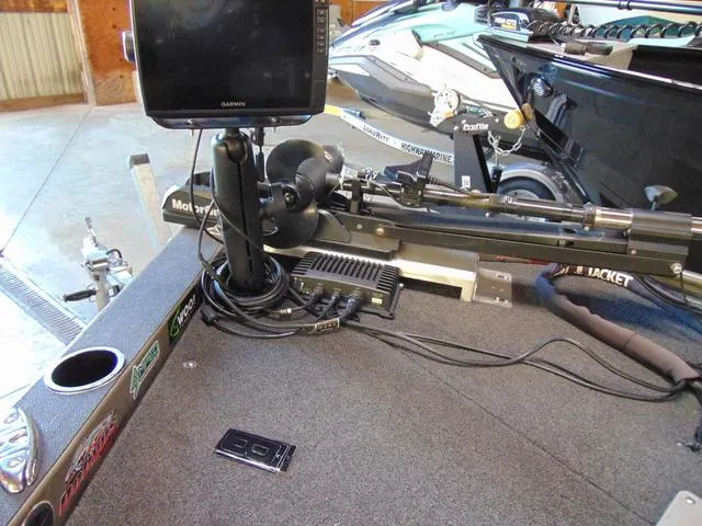 Slide: The Image of 2016 WeldBilt 1647 boat with Garmin fishfinder and trolling motor setup. - 7