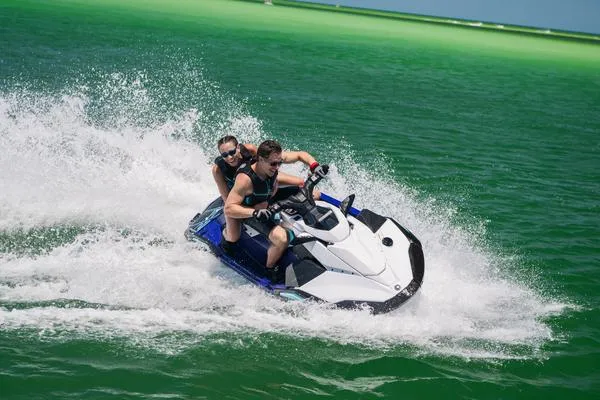 Slide: The Image of 2025 Yamaha Waverunner Jet Blaster LTD 3UP speeding on vibrant green water. - 13